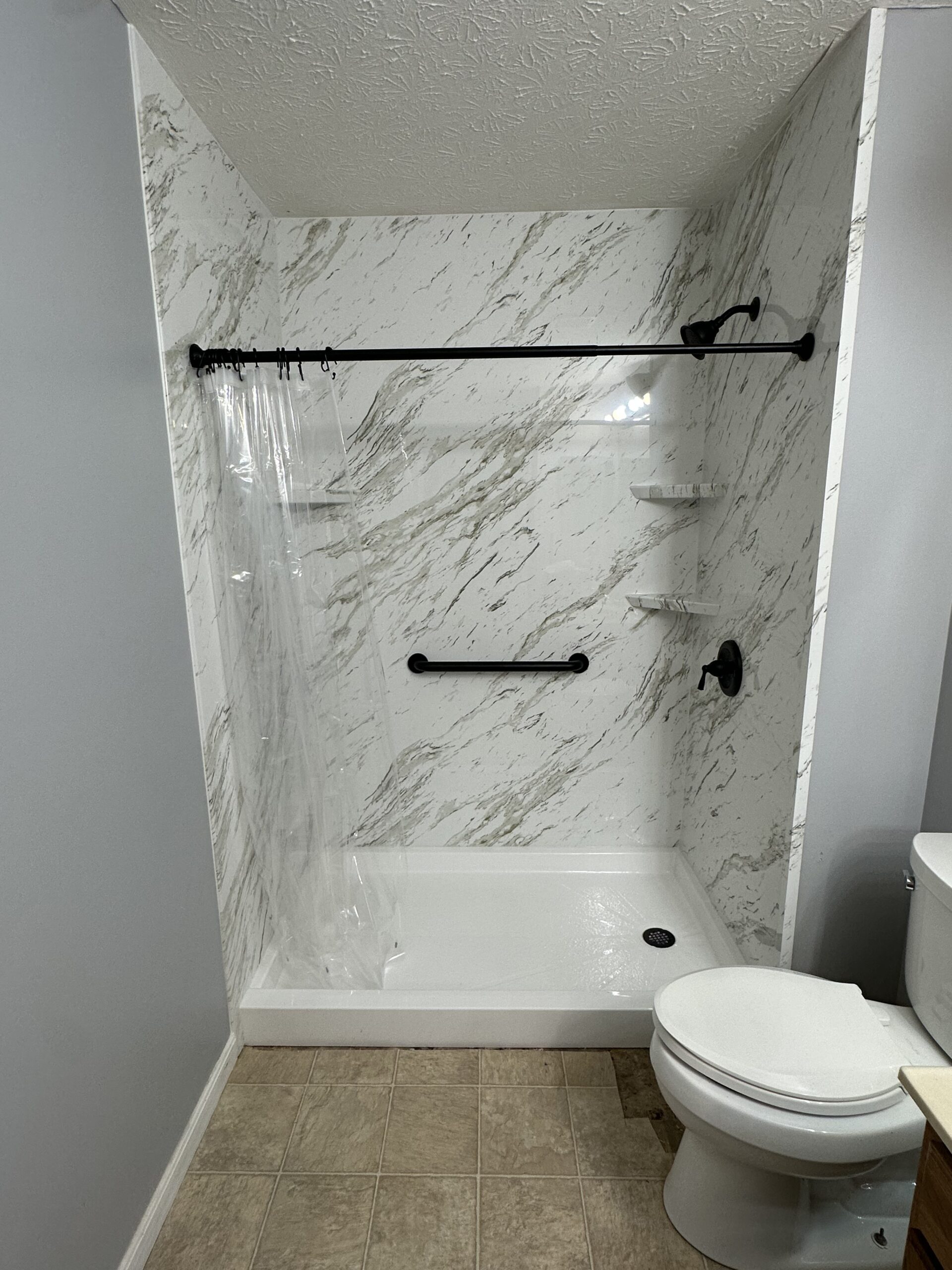 Tub to shower conversion with vintage calcutta marble in Union, KY.