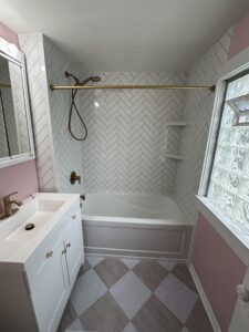 Tub to tub conversion with herringbone and brass fixtures in Indian Hill, OH.