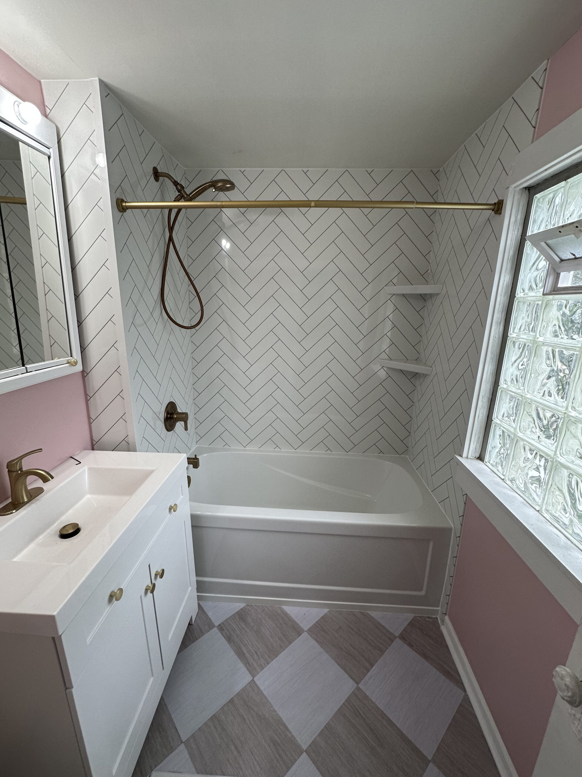 Tub to tub conversion with herringbone and brass fixtures in Indian Hill, OH.